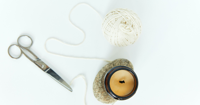 scissors yarn and candle